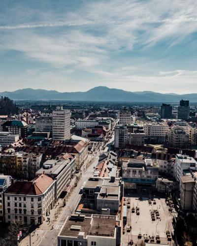 Free A stunning aerial view of Ljubljana, Slovenia featuring the city's buildings, castle, and surrounding mountains. Stock Photo